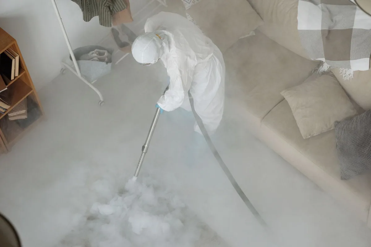 Biohazard cleanup technician in protective equipment, Berea, OH